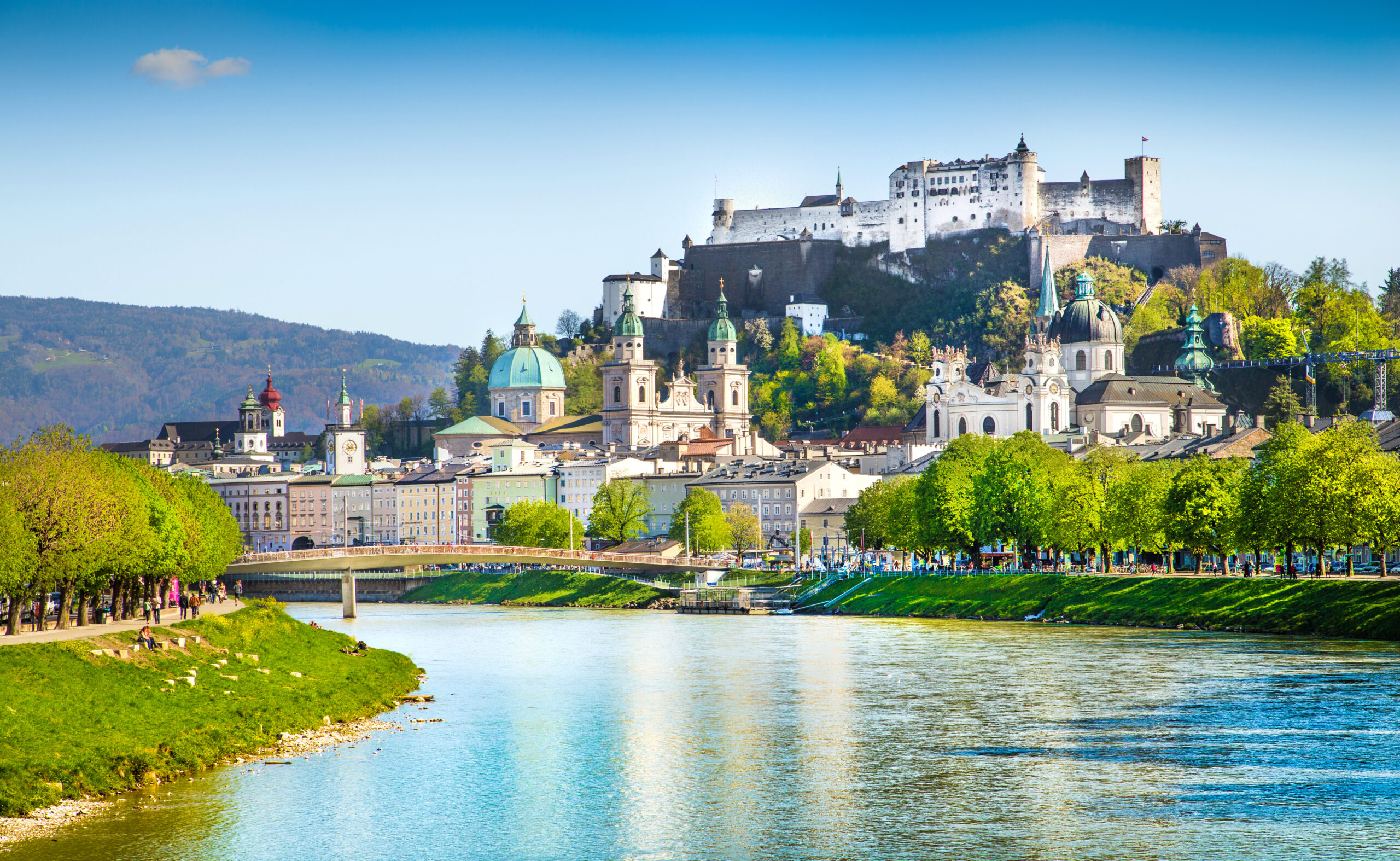 Salzburg skyline with river Salzach in springtime, Austria Beautiful view of Salzburg skyline with Festung Hohensalzburg and Salzach river in summer, Salzburg, Salzburger Land, Austria